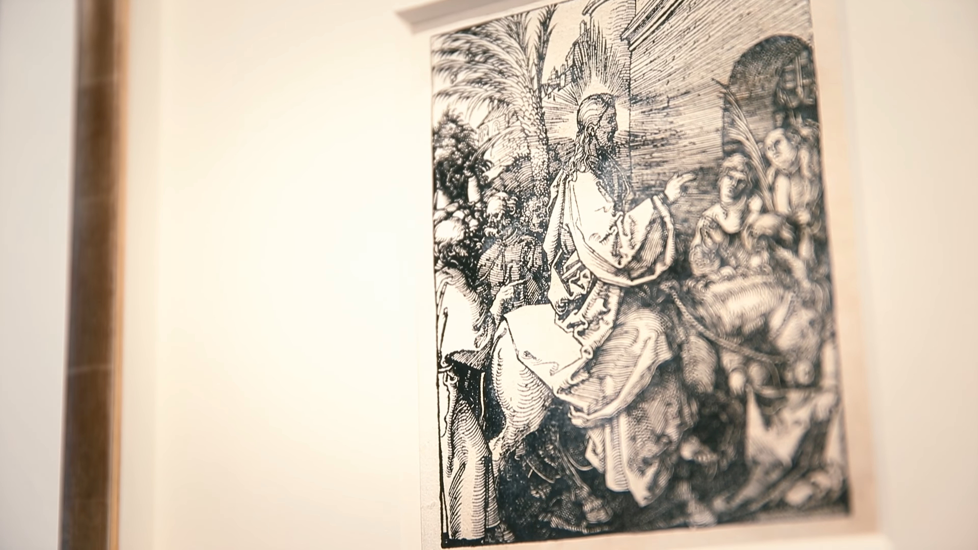 close-up of an exhibition wall displaying Albrecht Dürer’s woodcut artwork featuring religious figures and scenes, emphasizing detailed craftsmanship and historical significance